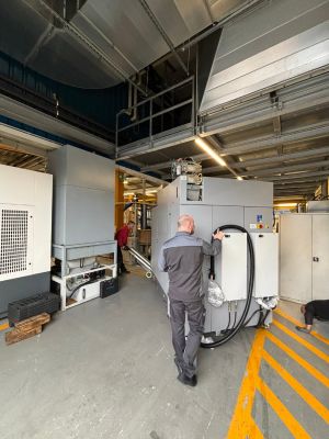 Industrial Workshop Scene Featuring Workers and Equipment in an Organized Setting