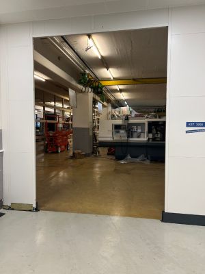 Industrial Workshop Interior with Equipment and Machinery in Operation