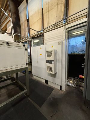 Indoor Factory Setup with Electrical Cabinet and Ventilation System