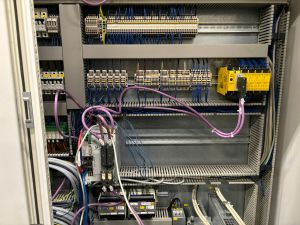 Industrial Electrical Control Panel Wiring Featuring Cables and Circuit Components