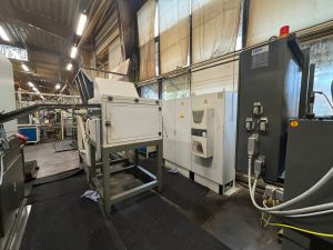 Industrial Manufacturing Equipment in a Spacious Factory Setting With Active Machinery