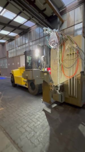 Industrial Forklift Handling Equipment in a Large Indoor Warehouse Setting