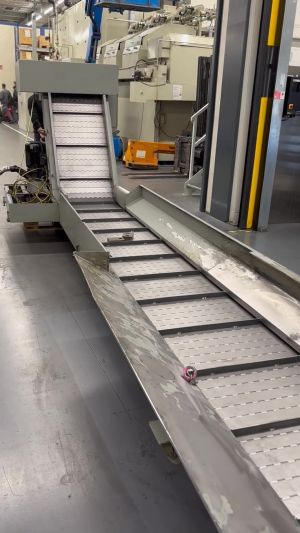 Conveyor System in Operation Within an Industrial Manufacturing Setting