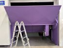 Purple Industrial Equipment Inside Facility With Metallic Ladder Positioned Nearby