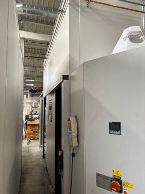 Industrial machinery in a factory with control panel and equipment