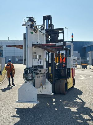 Industrial Forklift Operating Heavy Machinery in a Modern Factory Setting Outdoors