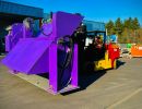 Purple Industrial Equipment on Forklift in Outdoor Machinery Storage Facility