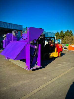 Purple Industrial Equipment on Forklift in Outdoor Machinery Storage Facility