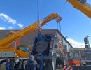 Large Industrial Equipment Being Lifted by Cranes at a Worksite